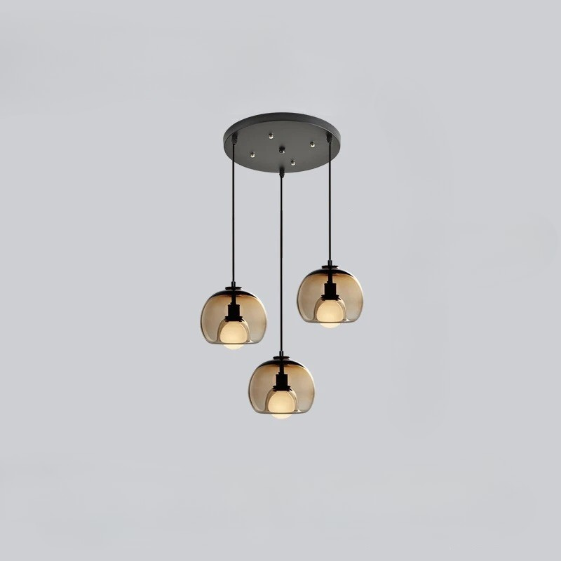 Orbis pendant light with Nordic-inspired glass design casting warm ambient glow for modern interiors