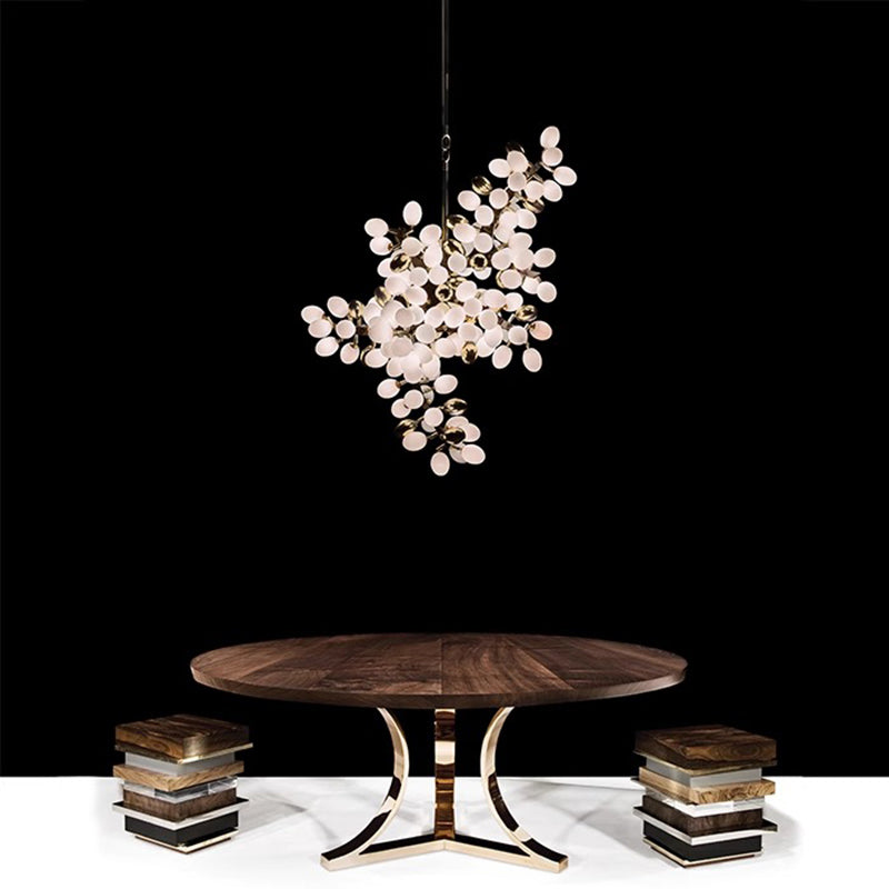 Vynelle chandelier with black and French gold egg-shaped glass design creating warm ambient luxury lighting