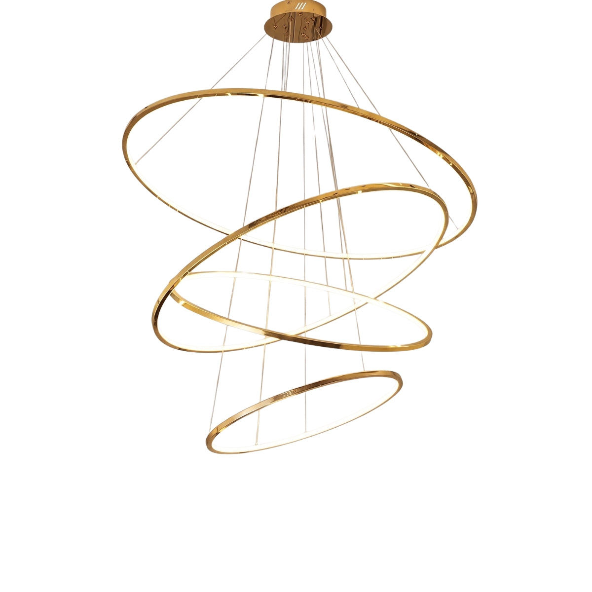 A modern spiral chandelier with four interlocking horizontal rings in a brushed gold finish, suspended by thin cables from a matching circular ceiling canopy, shown against a solid white background.
