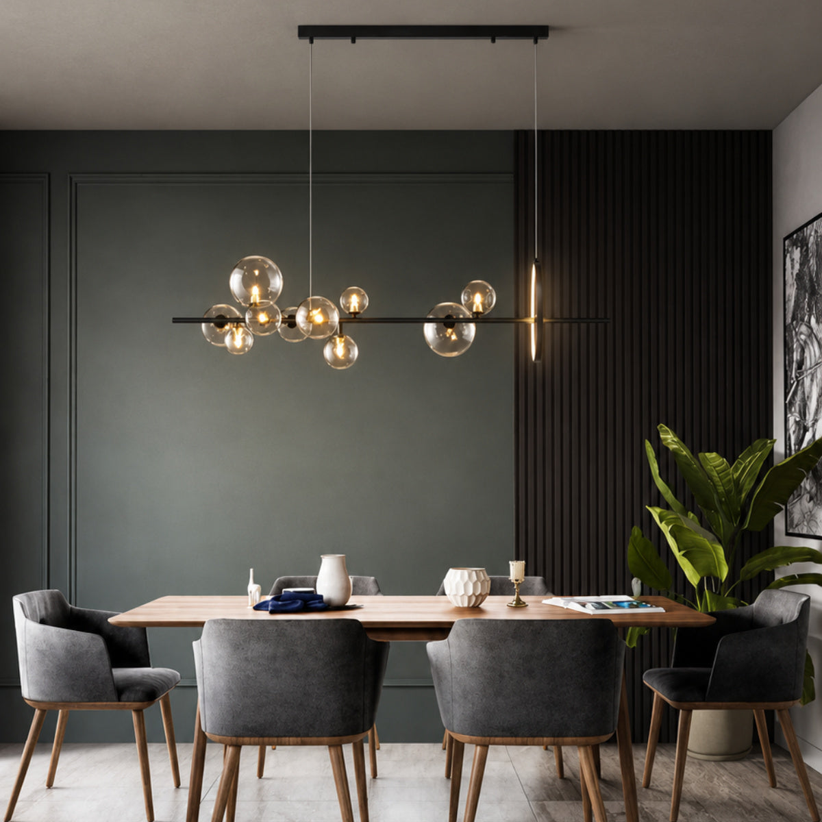 Modern multi-light cluster pendant chandelier with clear glass globes and warm gold-toned bulbs hanging over a dining table in a contemporary dark gray and black dining room.