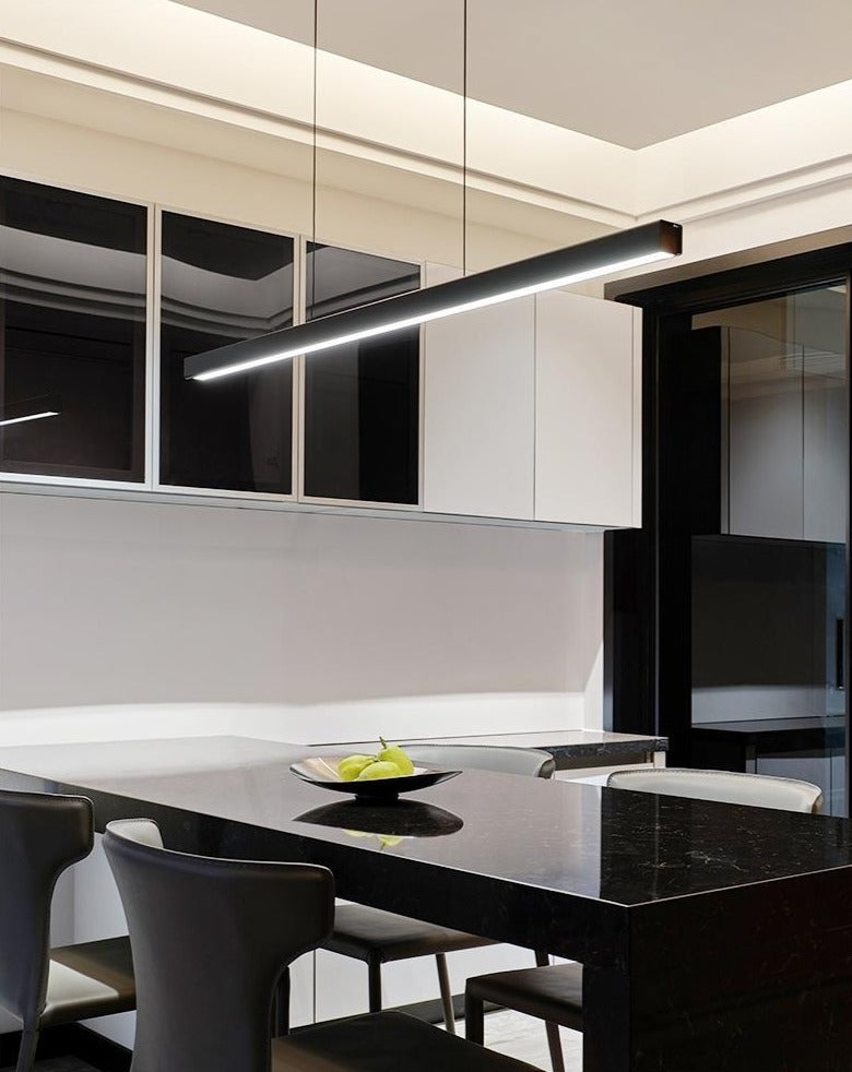ED chandelier with a rectangular frame hanging over a dining table.
